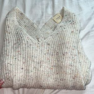 Francesca’s Harper heritage confetti cream cross back v neck cozy sweater